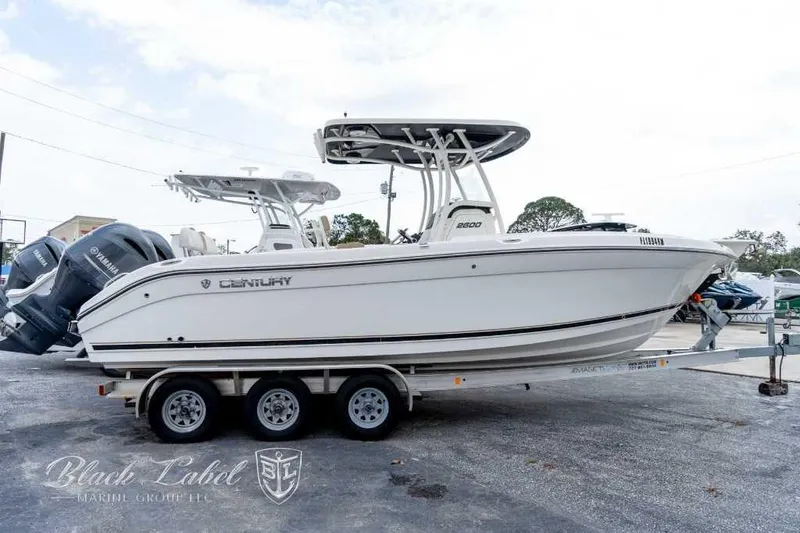 Slide: The Image of 2017 Century 2600 boat on trailer, side view, with Yamaha engines. - 1