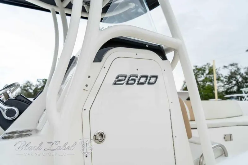 Slide: The Image of 2017 Century 2600 boat console with steering wheel and logo. - 22