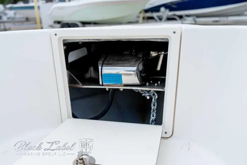 Slide: The Image of Open anchor locker on 2017 Century 2600 boat, showing chain and mechanism. - 6