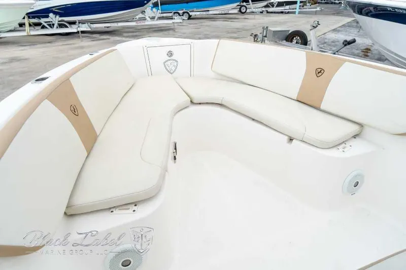 Slide: The Image of 2017 Century 2600 boat interior with beige seating and speaker system. - 9
