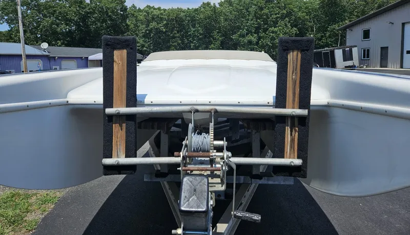 Slide: The Image of Rear view of a 2000 Eliminator 25 Daytona boat on a trailer. - 14