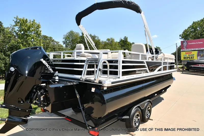 Slide: The Image of 2025 Ranger 223FC pontoon boat with 200HP Mercury 4 Stroke engine, parked outdoors. - 11
