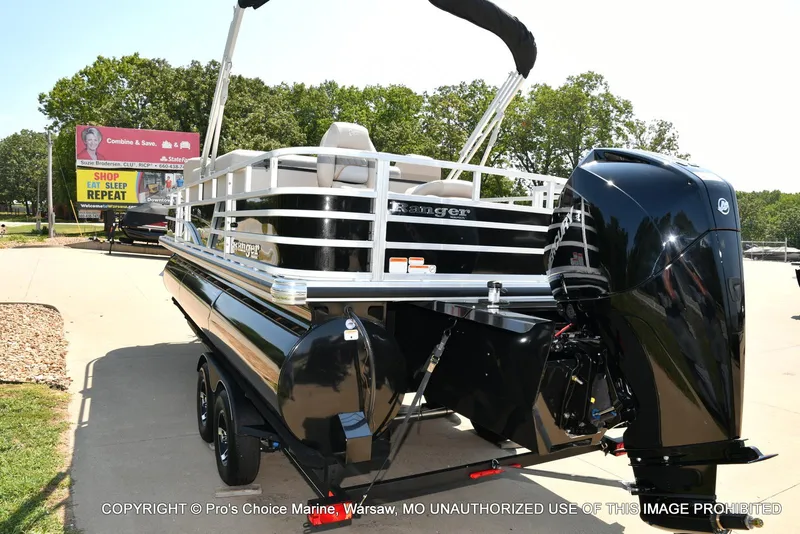 Slide: The Image of 2025 Ranger 223FC boat with 200HP Mercury 4 Stroke engine, parked outdoors. - 15