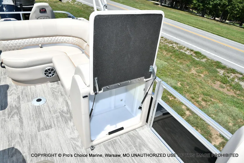 Slide: The Image of 2025 Ranger 223FC boat interior with storage compartment and seating. - 25