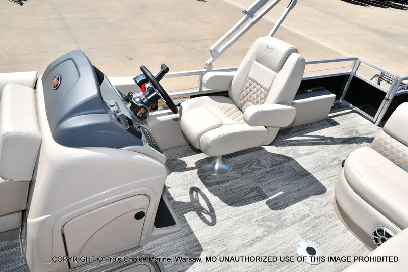 Slide: The Image of 2025 Ranger 223FC boat interior with steering console and plush seating. - 28