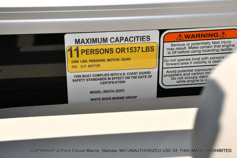 Slide: The Image of 2025 Ranger 223FC boat capacity label, 11 persons or 1537 lbs, 200HP Mercury engine. - 31