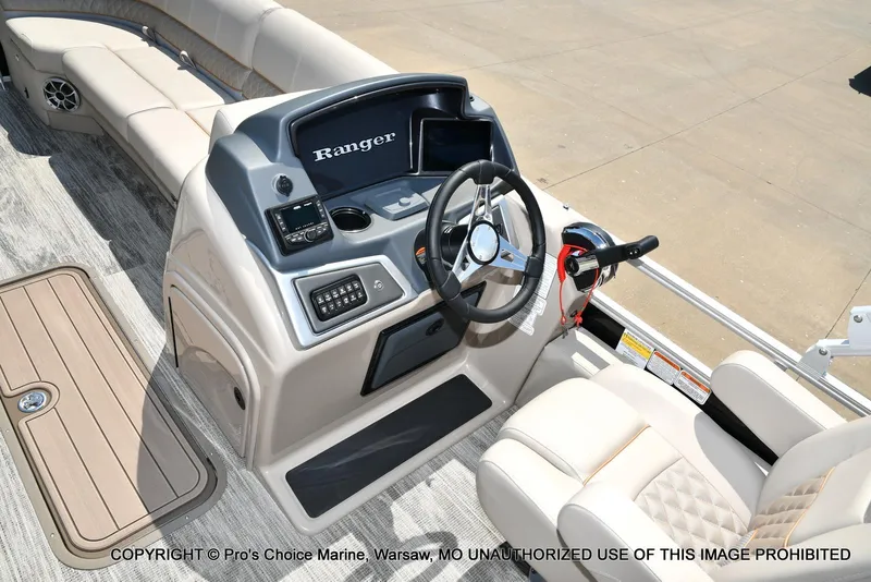 Slide: The Image of Ranger 223FC boat interior with steering console, 2025 model, featuring 200HP Mercury 4 Stroke engine. - 32