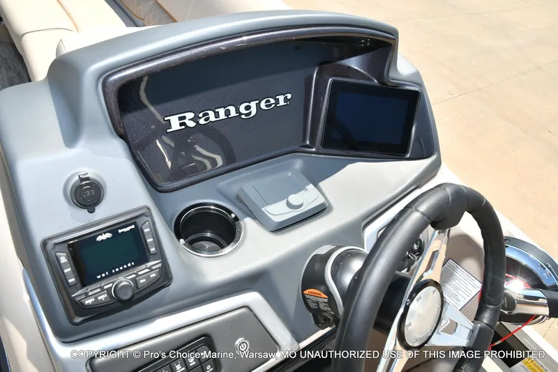 Slide: The Image of Dashboard of 2025 Ranger 223FC boat with steering wheel and control panel. - 33
