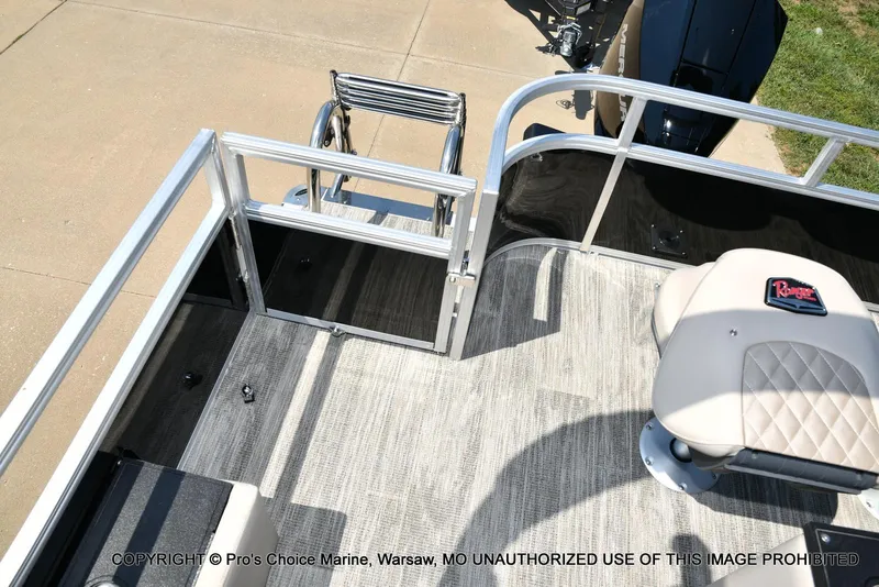 Slide: The Image of 2025 Ranger 223FC boat interior with Mercury 200HP engine, featuring seating and railing. - 38