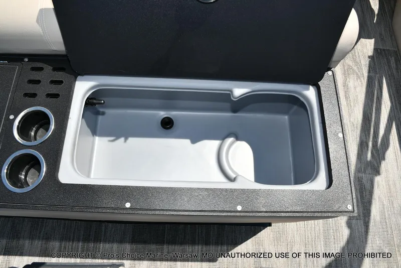 Slide: The Image of 2025 Ranger 223FC boat livewell with cup holders, open lid view. - 45