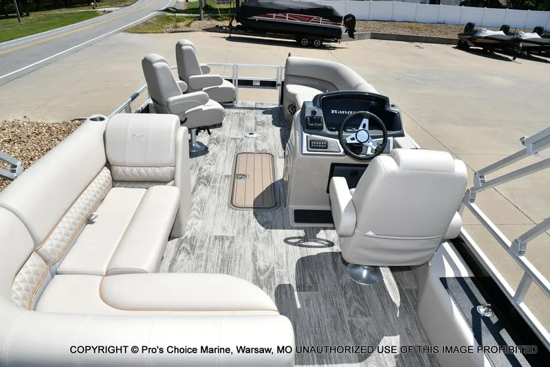 Slide: The Image of 2025 Ranger 223FC boat interior with plush seating and modern helm, featuring 200HP Mercury 4 Stroke. - 6