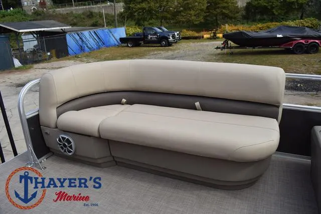 Slide: The Image of 2025 Sun Tracker PARTY BARGE® 16 DLX with beige seating at Thayer's Marine. - 13