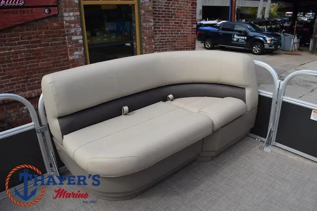 Slide: The Image of 2025 Sun Tracker PARTY BARGE® 16 DLX pontoon boat seating area at Thayer's Marine. - 15