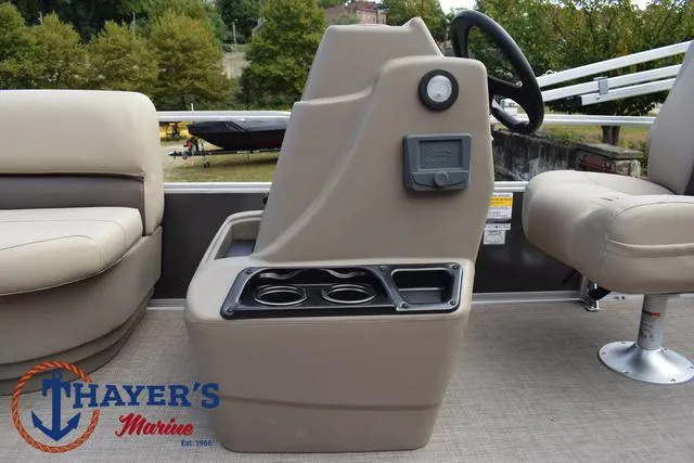 Slide: The Image of 2025 Sun Tracker PARTY BARGE® 16 DLX interior with seating and control console. - 21
