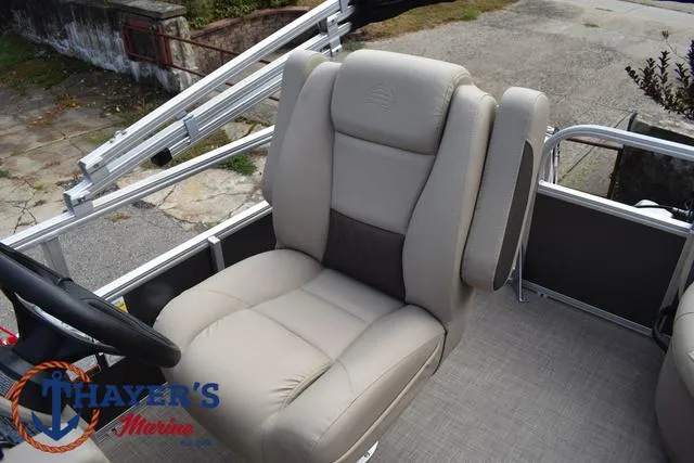 Slide: The Image of 2025 Sun Tracker PARTY BARGE® 16 DLX captain's chair, beige upholstery, Thayer's Marine logo. - 24