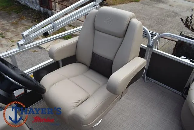 Slide: The Image of 2025 Sun Tracker PARTY BARGE® 16 DLX captain's chair, beige upholstery, on deck. - 25