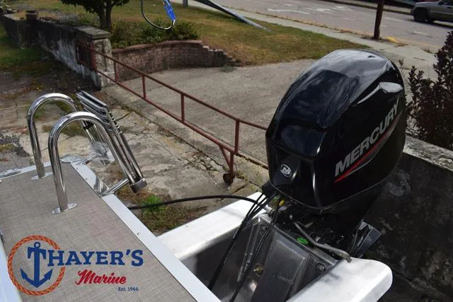 Slide: The Image of 2025 Sun Tracker PARTY BARGE® 16 DLX with Mercury outboard motor at Thayer's Marine. - 26