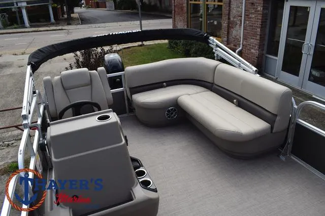 Slide: The Image of 2025 Sun Tracker PARTY BARGE® 16 DLX interior with seating and helm. - 28