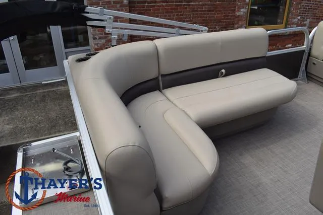 Slide: The Image of 2025 Sun Tracker PARTY BARGE® 16 DLX pontoon boat with beige seating. - 29