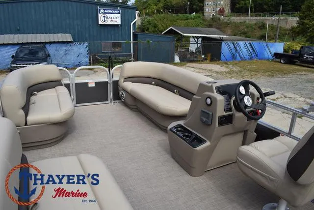 Slide: The Image of 2025 Sun Tracker PARTY BARGE® 16 DLX interior with seating and steering console at Thayer's Marine. - 30