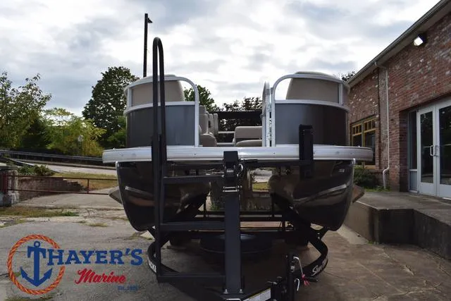 Slide: The Image of 2025 Sun Tracker PARTY BARGE® 16 DLX pontoon boat on trailer at Thayer's Marine. - 31