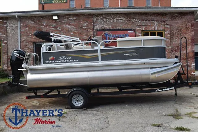 Slide: The Image of 2025 Sun Tracker PARTY BARGE® 16 DLX pontoon boat on trailer at Thayer's Marine. - 35