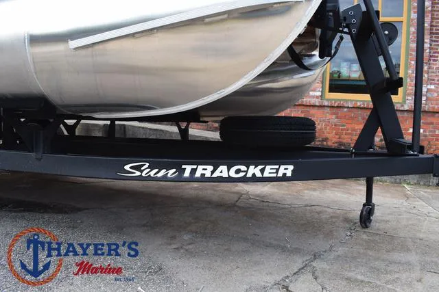 Slide: The Image of 2025 Sun Tracker PARTY BARGE® 16 DLX on trailer at Thayer's Marine. - 7