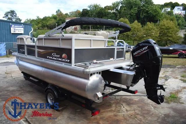 Slide: The Image of 2025 Sun Tracker PARTY BARGE® 16 DLX pontoon boat with Mercury outboard motor. - 9