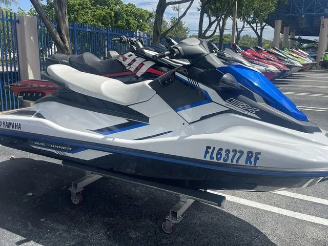 Slide: The Image of 2017 Yamaha WaveRunner EX jet ski parked in a lot, side view. - 3