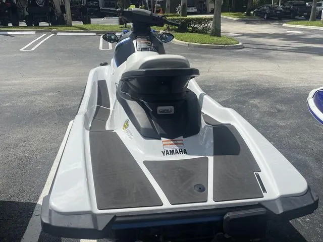 Slide: The Image of 2017 Yamaha WaveRunner EX jet ski parked in a lot, rear view. - 6