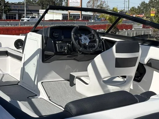 Slide: The Image of 2025 Yamaha AR195 boat interior with sleek white and gray seating design. - 6
