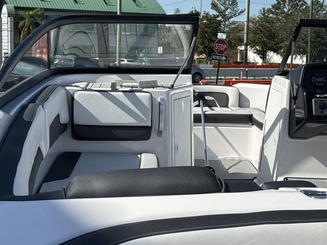 Slide: The Image of 2025 Yamaha AR195 boat interior with sleek white and black seating and modern design. - 7