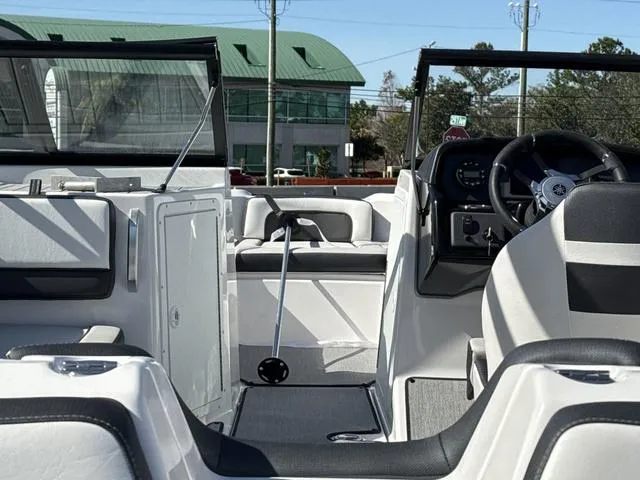Slide: The Image of 2025 Yamaha AR195 boat interior with sleek dashboard and steering wheel. - 8