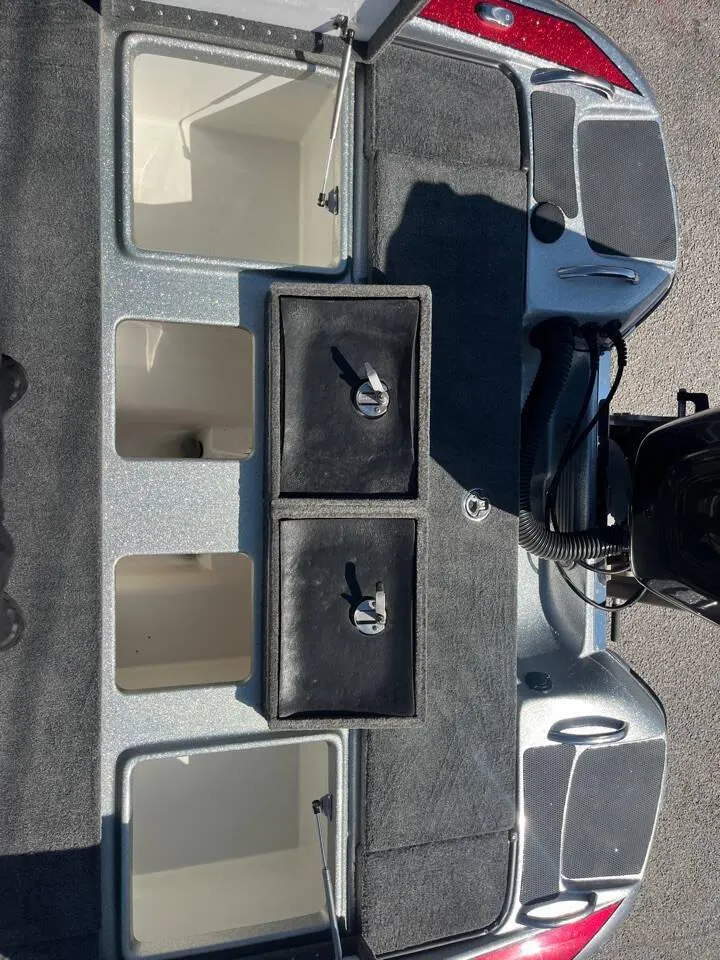 Slide: The Image of 2015 Phoenix 819 Pro boat storage compartments and seating area. - 12