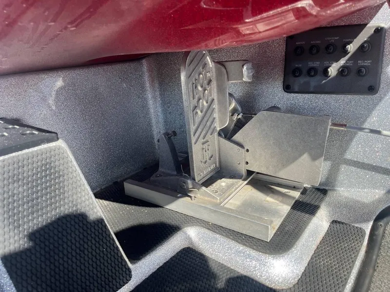 Slide: The Image of Foot pedal and control panel in 2015 Phoenix 819 Pro boat. - 13