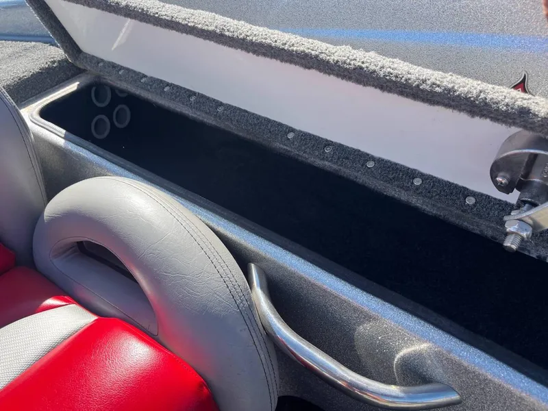 Slide: The Image of Interior of a 2015 Phoenix 819 Pro boat with red and gray seating. - 14