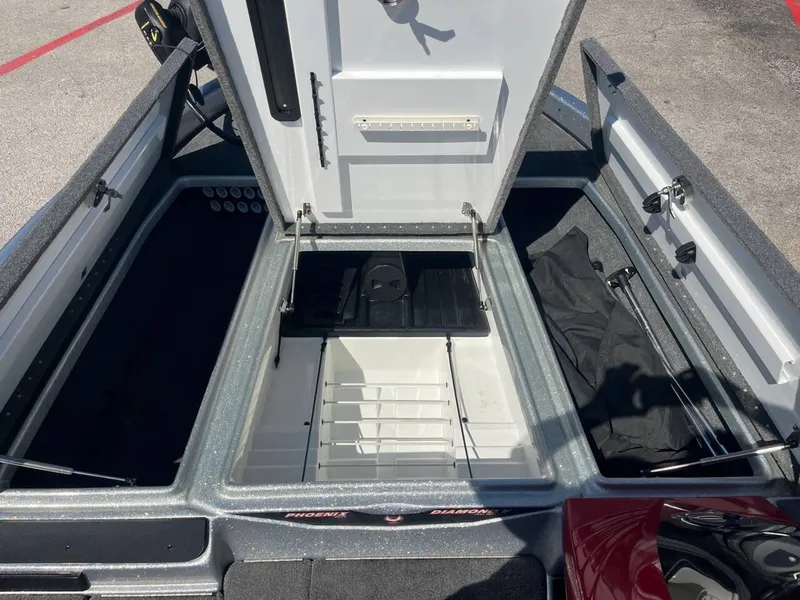 Slide: The Image of 2015 Phoenix 819 Pro boat storage compartments open, showcasing organized interior layout. - 17