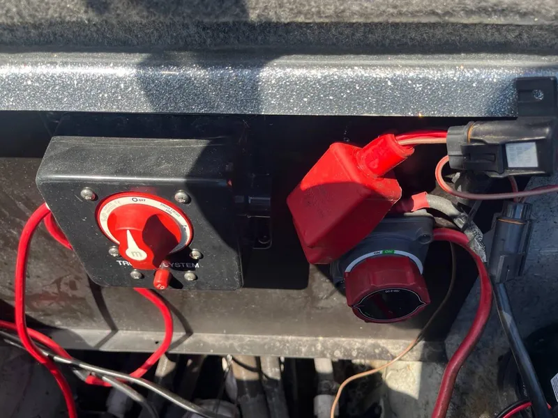 Slide: The Image of Close-up of electrical switches and wiring in a 2015 Phoenix 819 Pro boat. - 21