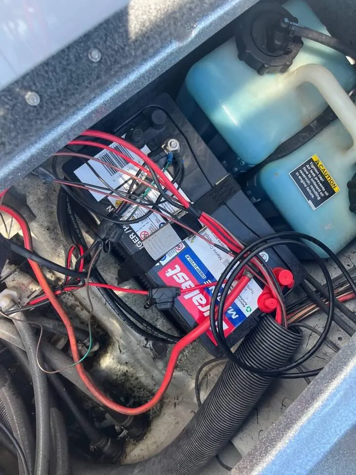 Slide: The Image of 2015 Phoenix 819 Pro battery compartment with wiring and fluid reservoir. - 22