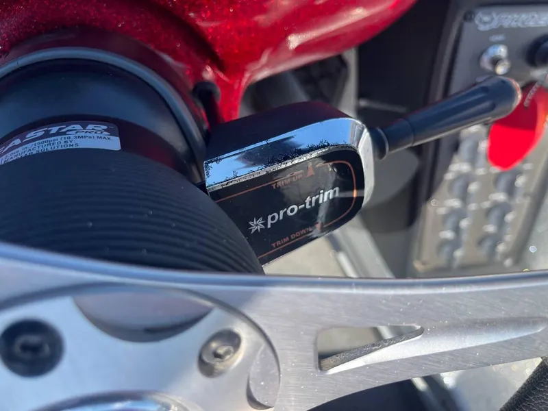 Slide: The Image of Close-up of a 2015 Phoenix 819 Pro boat steering wheel with pro-trim control. - 23