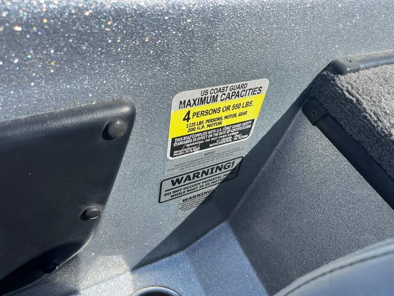 Slide: The Image of 2015 Phoenix 819 Pro boat capacity label, maximum 4 persons or 550 lbs. - 25
