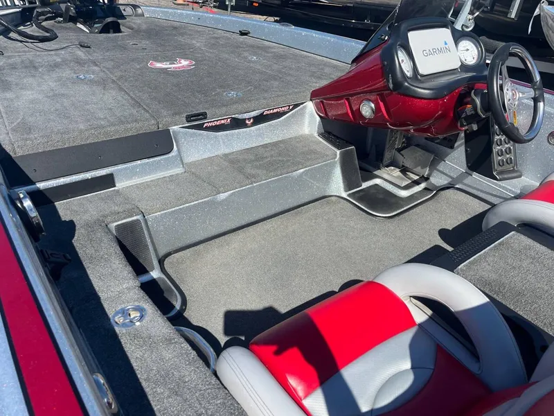 Slide: The Image of 2015 Phoenix 819 Pro boat interior with Garmin system, red and gray seating. - 33