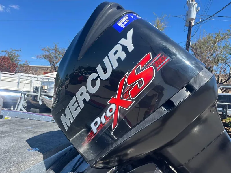 Slide: The Image of Mercury Pro XS engine on 2015 Phoenix 819 Pro boat, outdoor setting. - 34
