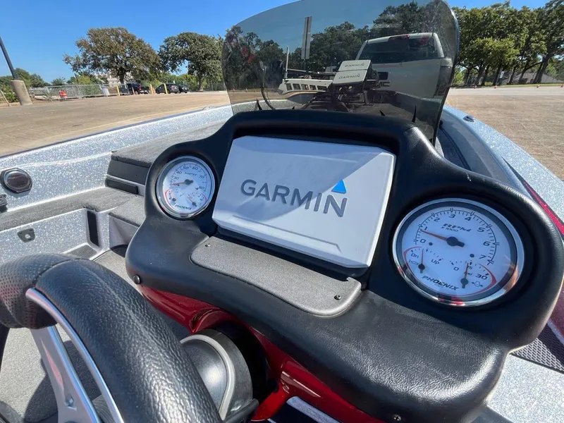 Slide: The Image of Phoenix 819 Pro 2015 boat dashboard with Garmin display and gauges. - 36