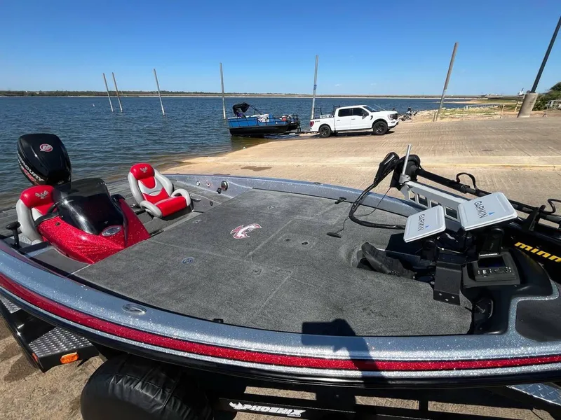 Slide: The Image of 2015 Phoenix 819 Pro fishing boat at lakeside dock with equipment. - 39