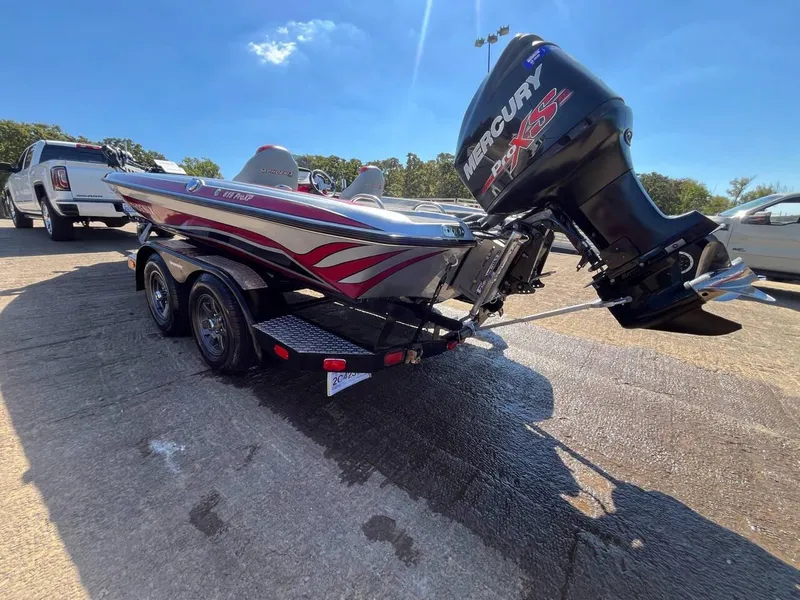 Slide: The Image of 2015 Phoenix 819 Pro boat with Mercury engine on trailer, parked outdoors. - 4