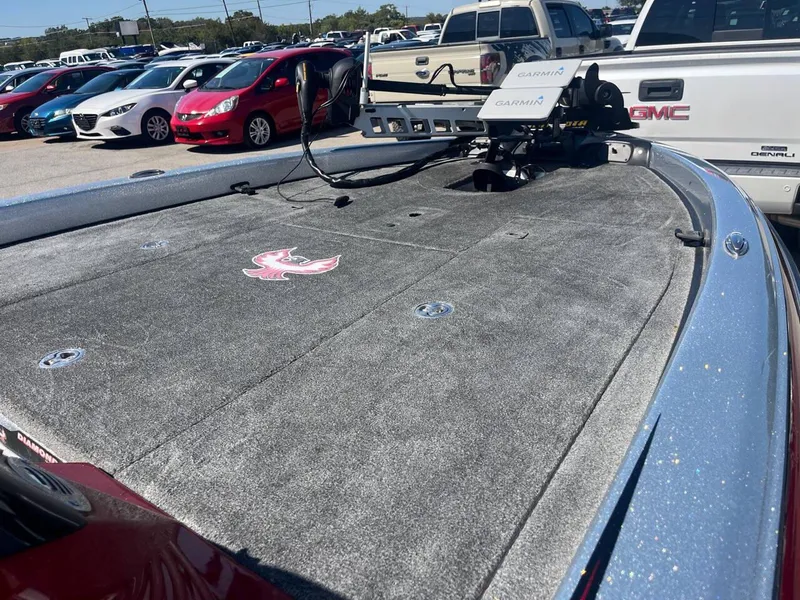 Slide: The Image of 2015 Phoenix 819 Pro boat deck with Garmin equipment, parked in a lot. - 45