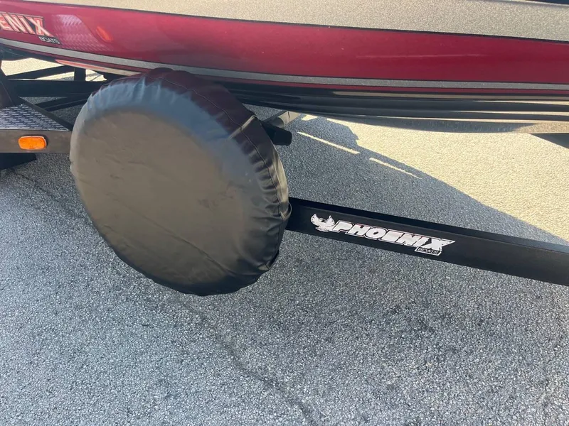 Slide: The Image of 2015 Phoenix 819 Pro boat trailer with spare tire cover on asphalt. - 46