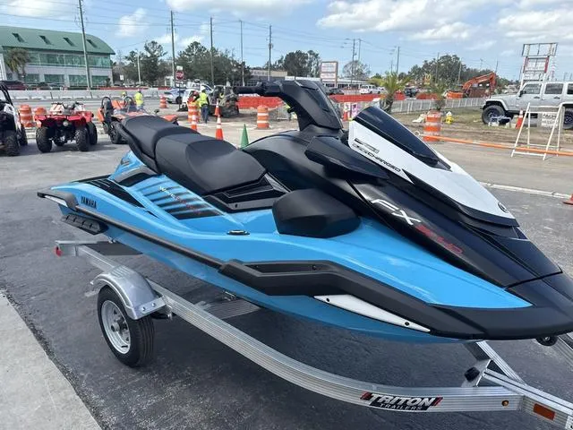 Slide: The Image of 2025 Yamaha Marine Waverunner FX SVHO in black and cyan on a trailer. - 11