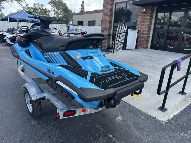 Slide: The Image of 2025 Yamaha Marine Waverunner FX SVHO in black and cyan, side view. - 4